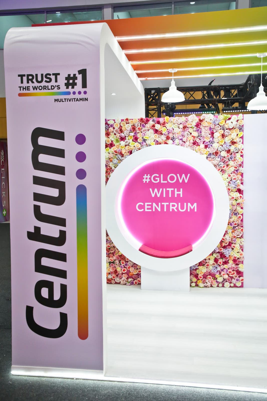 The Centrum stand with its floral wall and illuminated #GlowWithCentrum ring