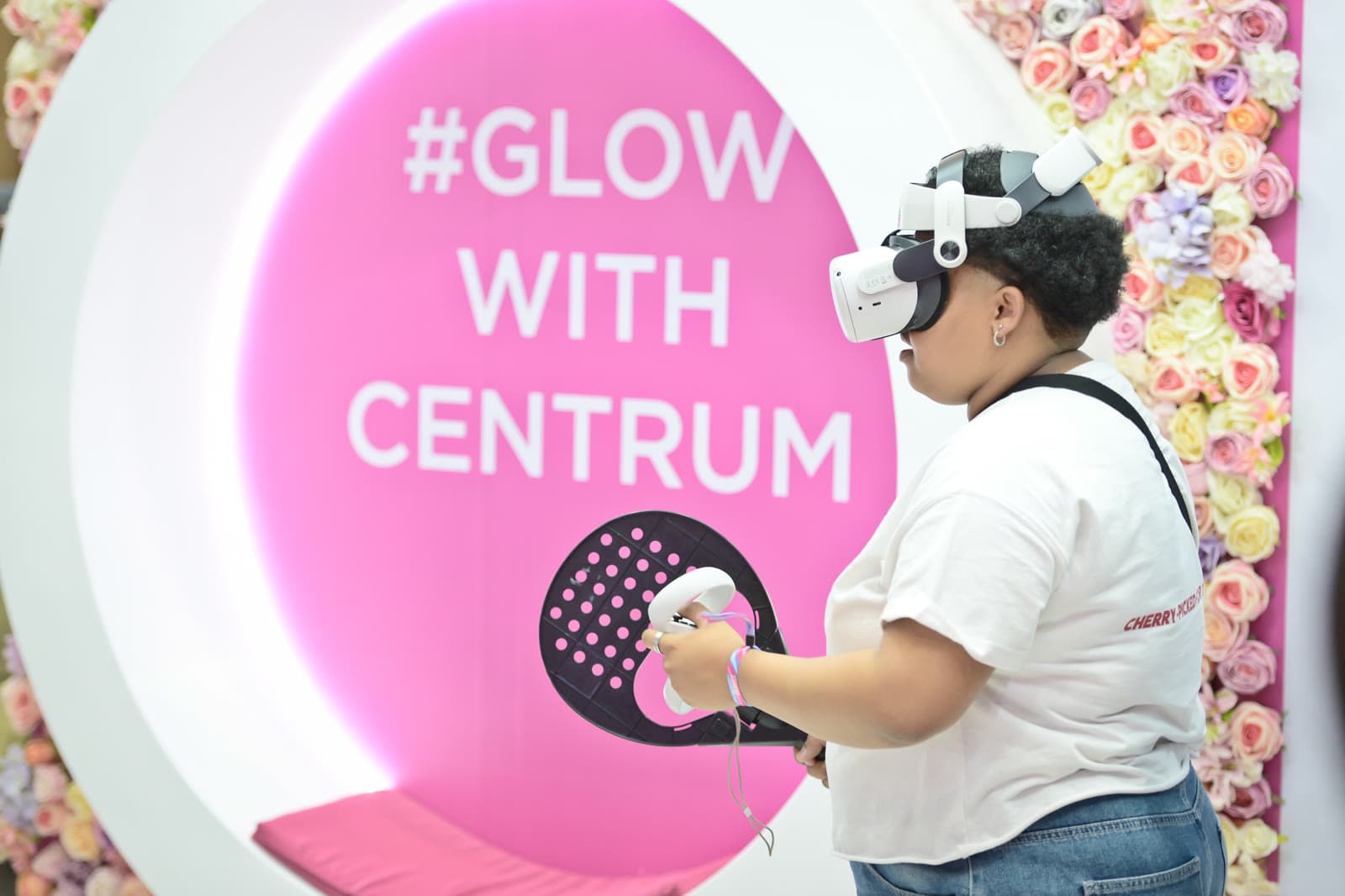 A visitor mid-swing in the VR padel game