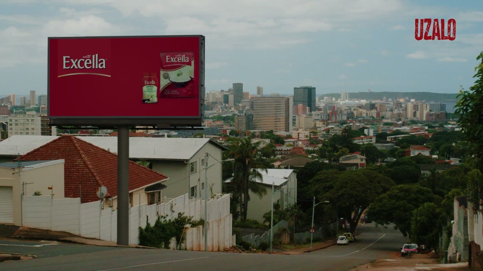 An Excella billboard placed inside a scene from Uzalo